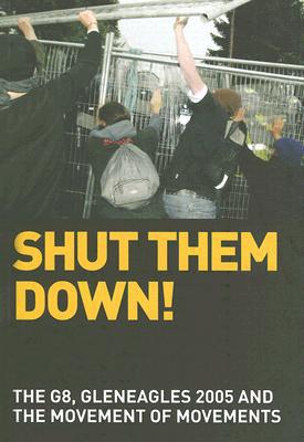 Four people pushing on a chain link fence, and hoisting another section of the fence above their heads in protest.